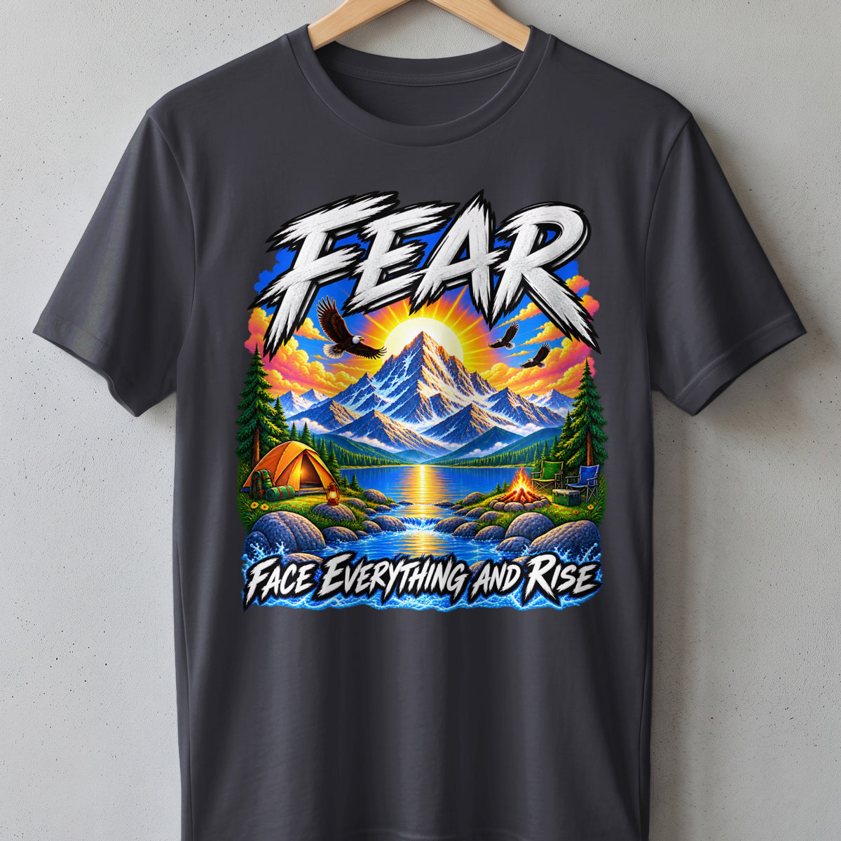T-shirt with mountain, lake, camping scene, and text "FEAR FACE EVERYTHING AND RISE".