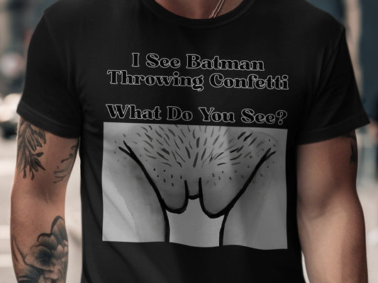 Black t-shirt with text "I See Batman Throwing Confetti" and an abstract drawing.