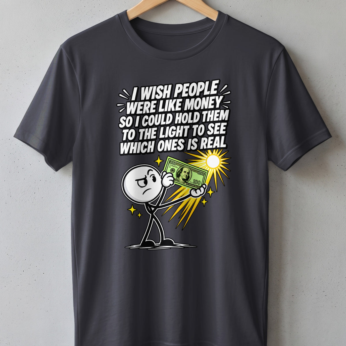 Dark grey t-shirt with cartoon character holding $100 bill to light, text reads "I wish people were like money..."