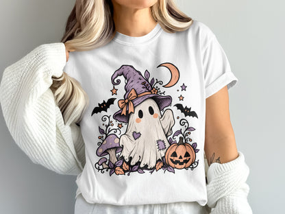 Cute ghost with witch hat, bats, mushroom, pumpkin, and moon on a white t-shirt.