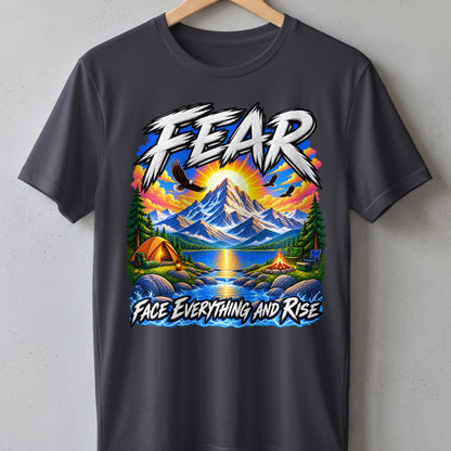 T-shirt with mountain, lake, camping scene, and text "FEAR FACE EVERYTHING AND RISE".