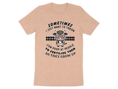 Peach t-shirt with a grumpy cow holding a mug and text about cow poop.
