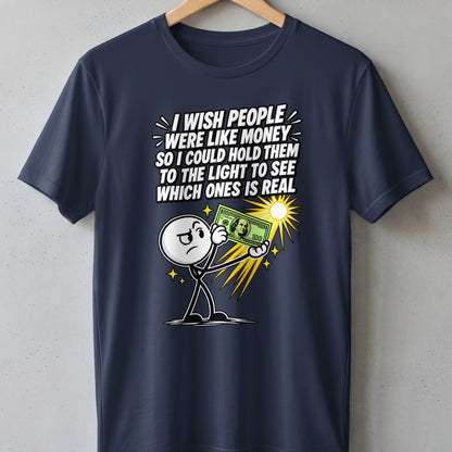 Dark blue t-shirt with cartoon character holding fake money and text about realness.