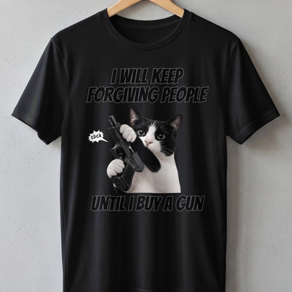 Black t-shirt with a cat holding a gun and text "I will keep forgiving people until I buy a gun".