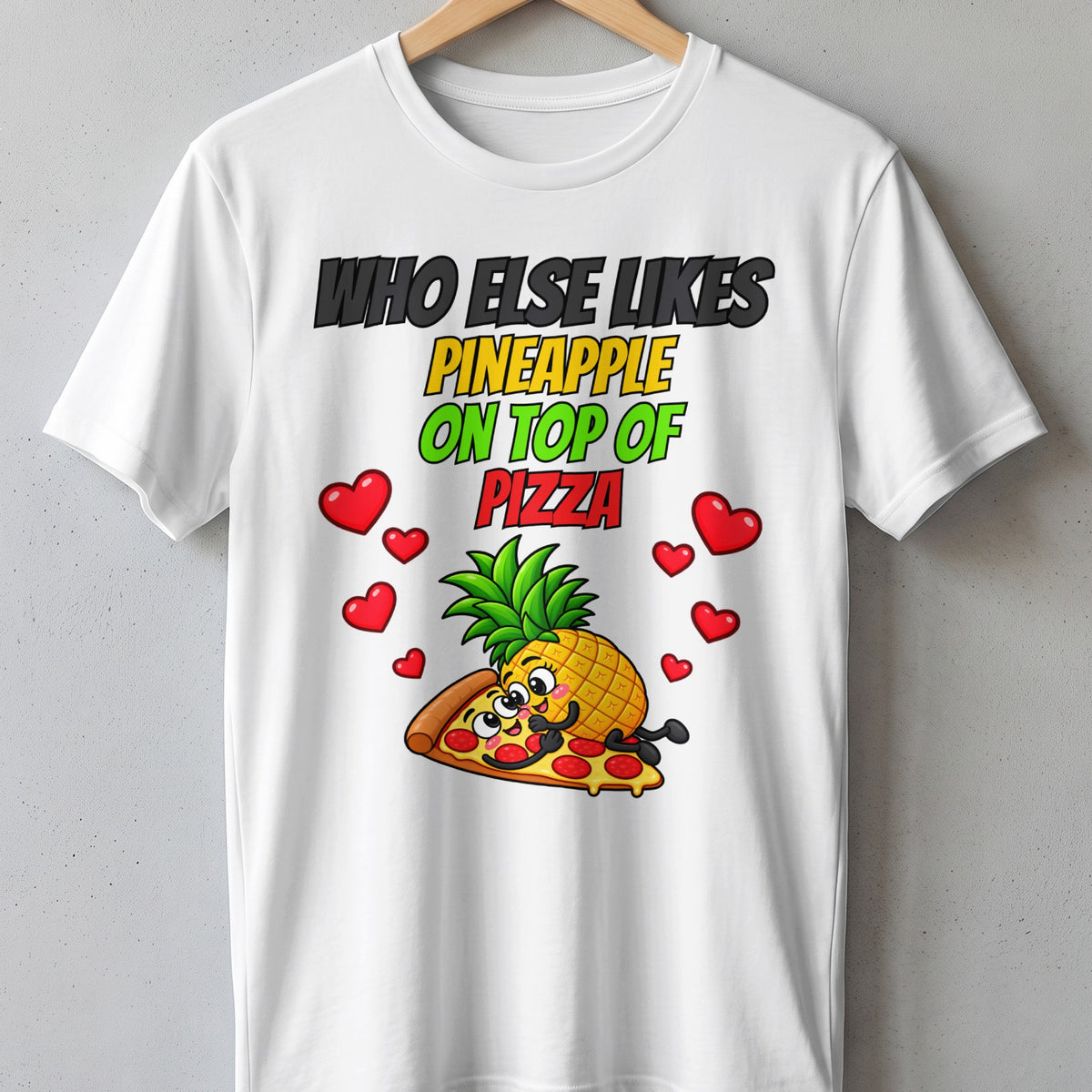 T-shirt with text "Who Else Likes Pineapple On Top Of Pizza" and cartoon characters.
