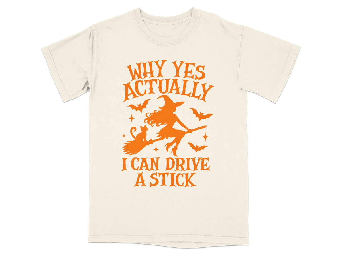 Cream t-shirt with orange Halloween graphic: witch flying, cat, bats, and text.