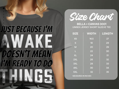 T-shirt with "Just Because I'm Awake Doesn't Mean I'm Ready To Do Things" text and size chart.