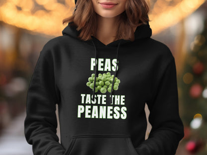 Black hoodie with green text and peas graphic: "PEAS TASTE THE PEANESS"
