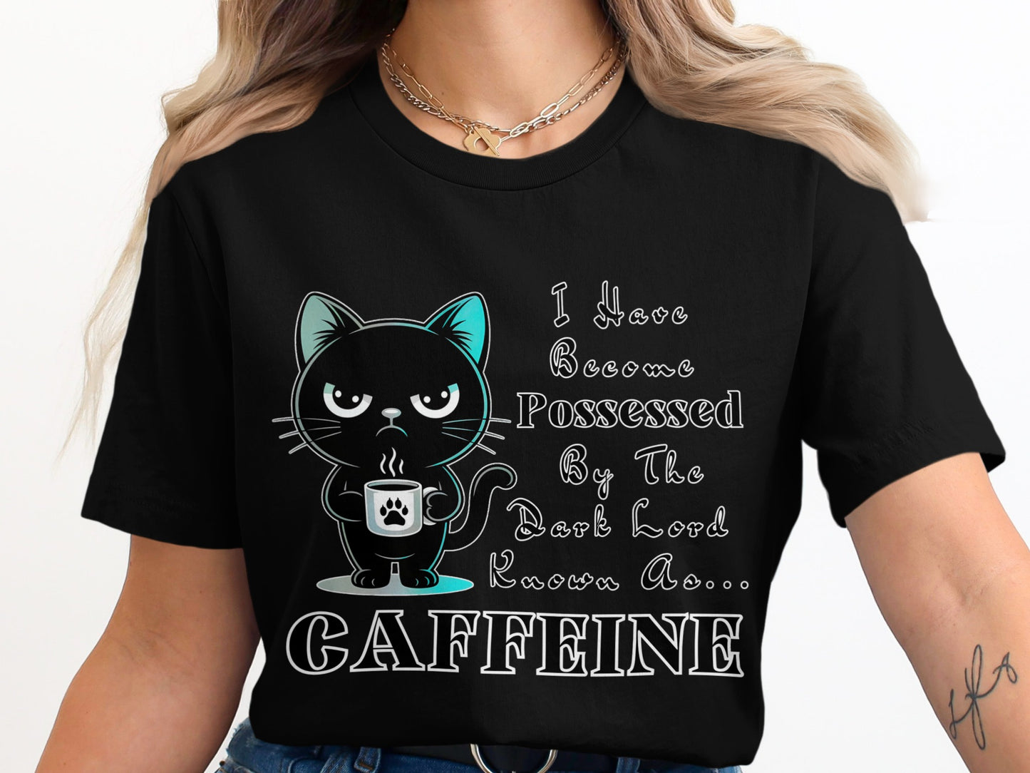 Black t-shirt with cartoon cat holding coffee cup and text "I Have Become Possessed By The Dark Lord Known As... CAFFEINE".
