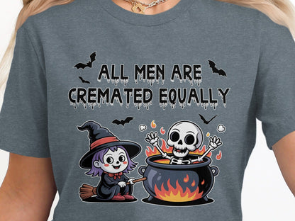 T-shirt graphic with witch, skeleton in cauldron, and text "ALL MEN ARE CREMATED EQUALLY."