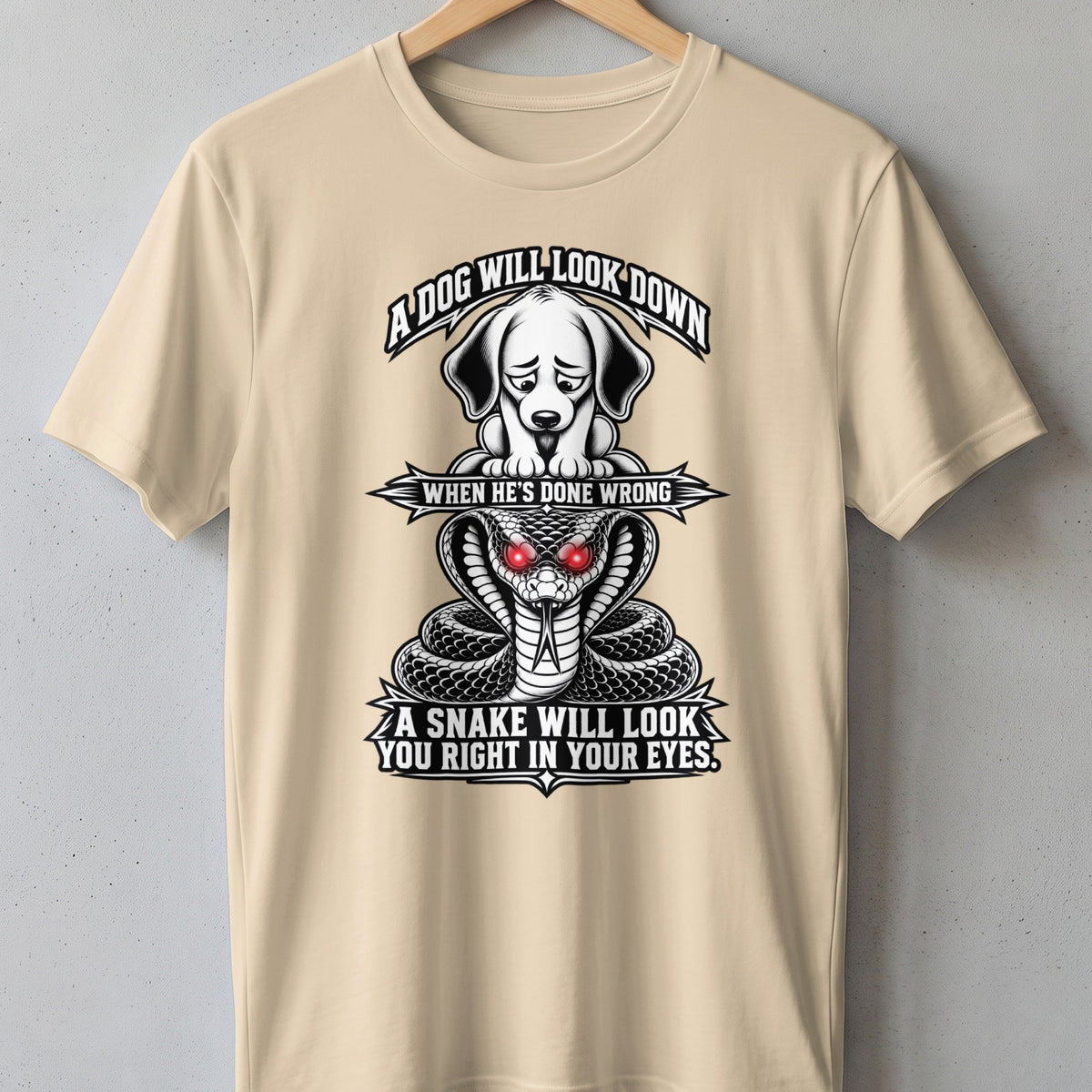 Beige t-shirt with a dog and snake graphic and text.