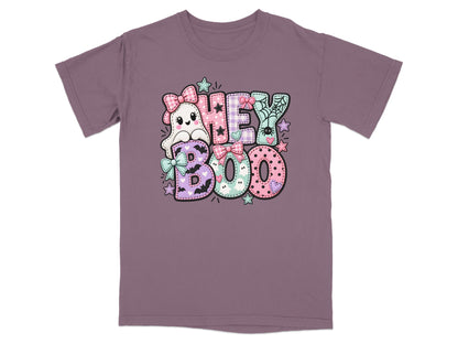 Ghost and lettering graphic reading "Hey Boo" on a purple t-shirt.