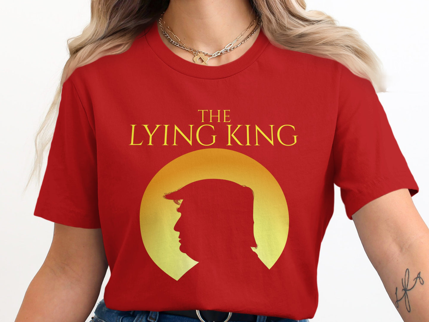 Red t-shirt with "The Lying King" text and silhouette of Donald Trump.