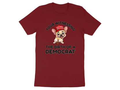 Maroon t-shirt with cartoon dog wearing "Make America Great Again" hat, and text "Your Witnessing The Birth of A Democrat".