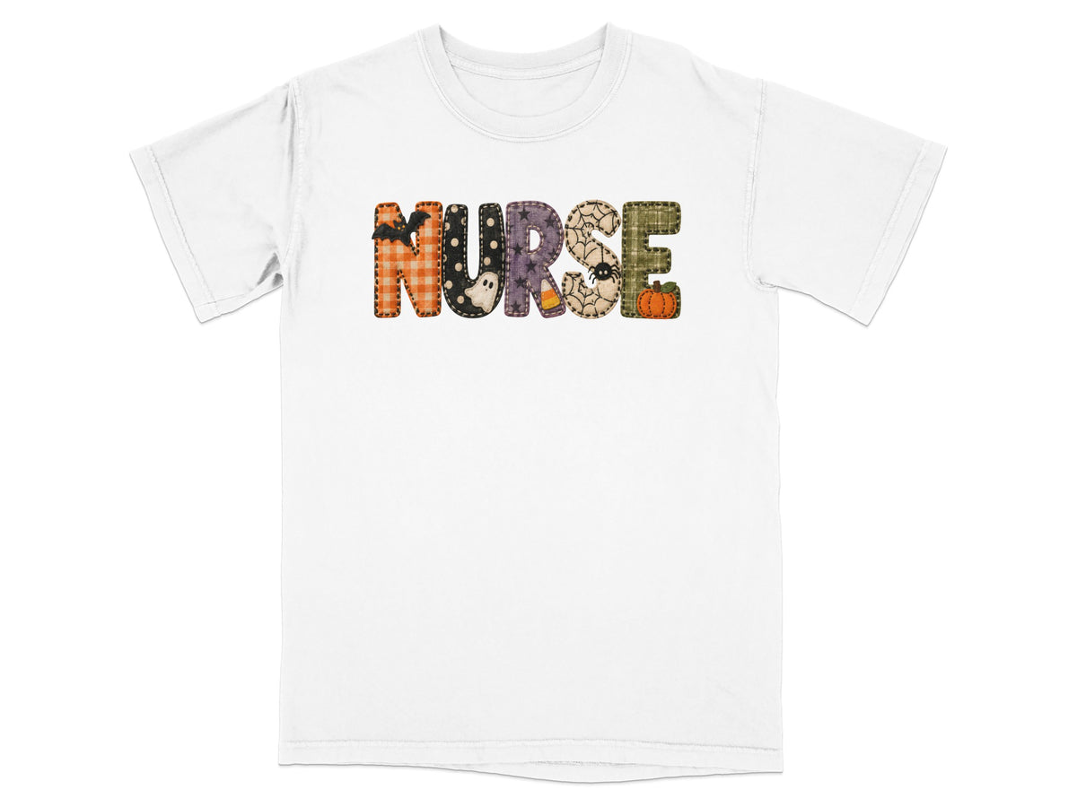 A white short-sleeved t-shirt features the word NURSE spelled out in patterned Halloween-themed fabric letters.