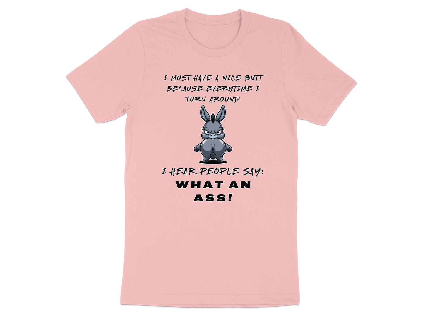 Pink t-shirt with cartoon donkey and text: "I MUST HAVE A NICE BUTT BECAUSE EVERYTIME I TURN AROUND I HEAR PEOPLE SAY: WHAT AN ASS!"