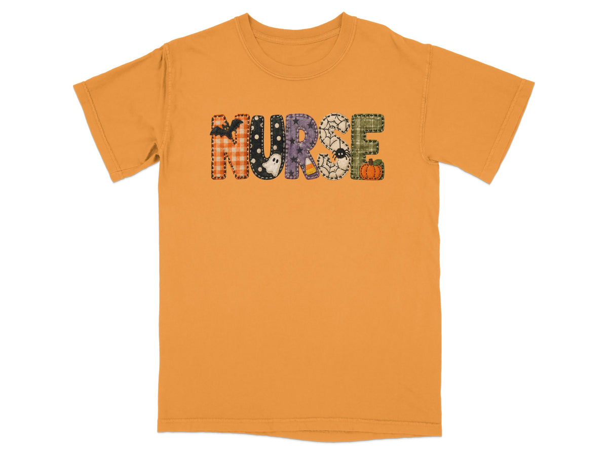 Gold t-shirt with the word NURSE spelled out in Halloween-themed patterned letters across the chest.