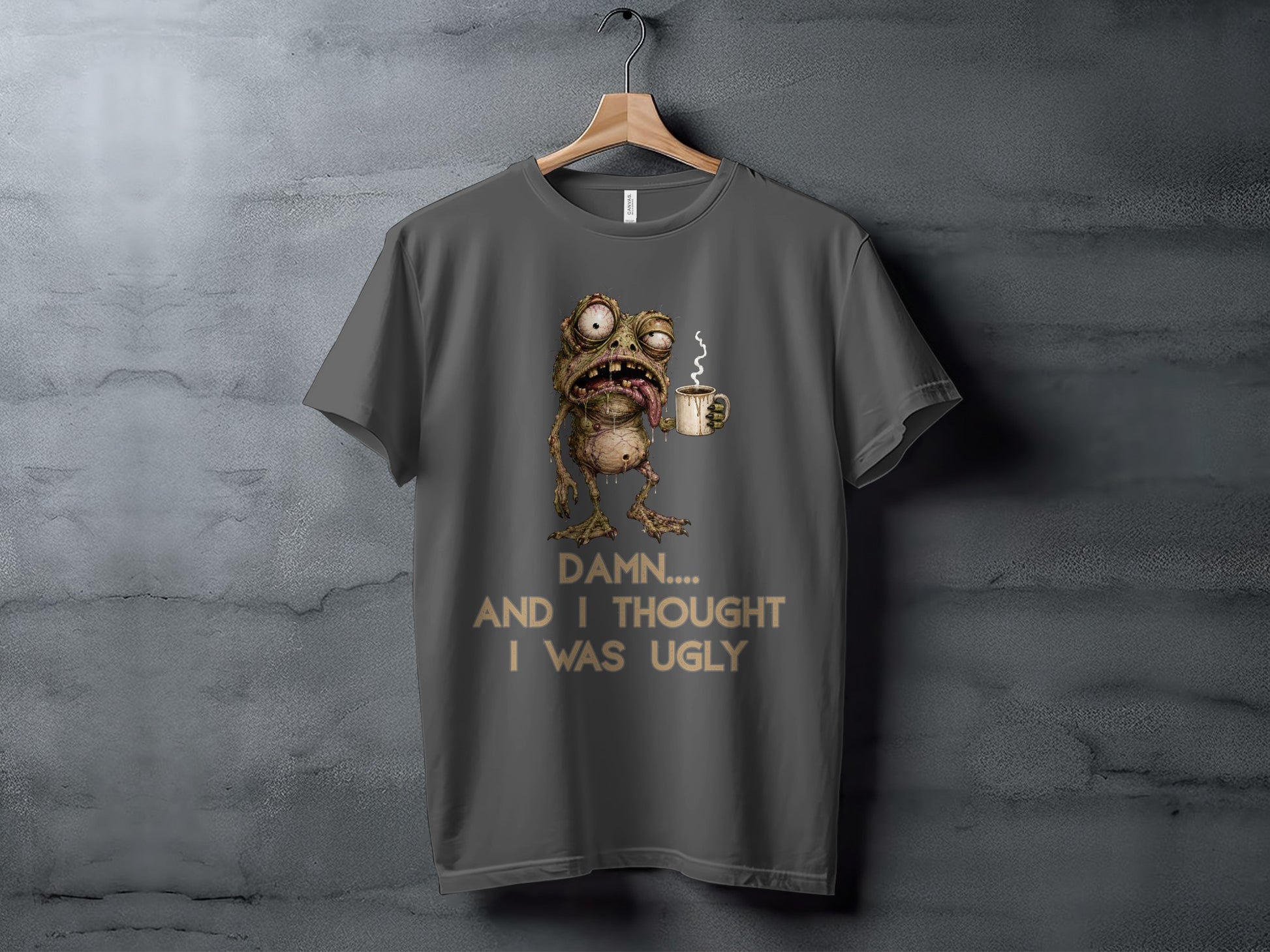 T-shirt with a cartoon zombie frog holding a coffee mug and text "Damn.... And I thought I was ugly".