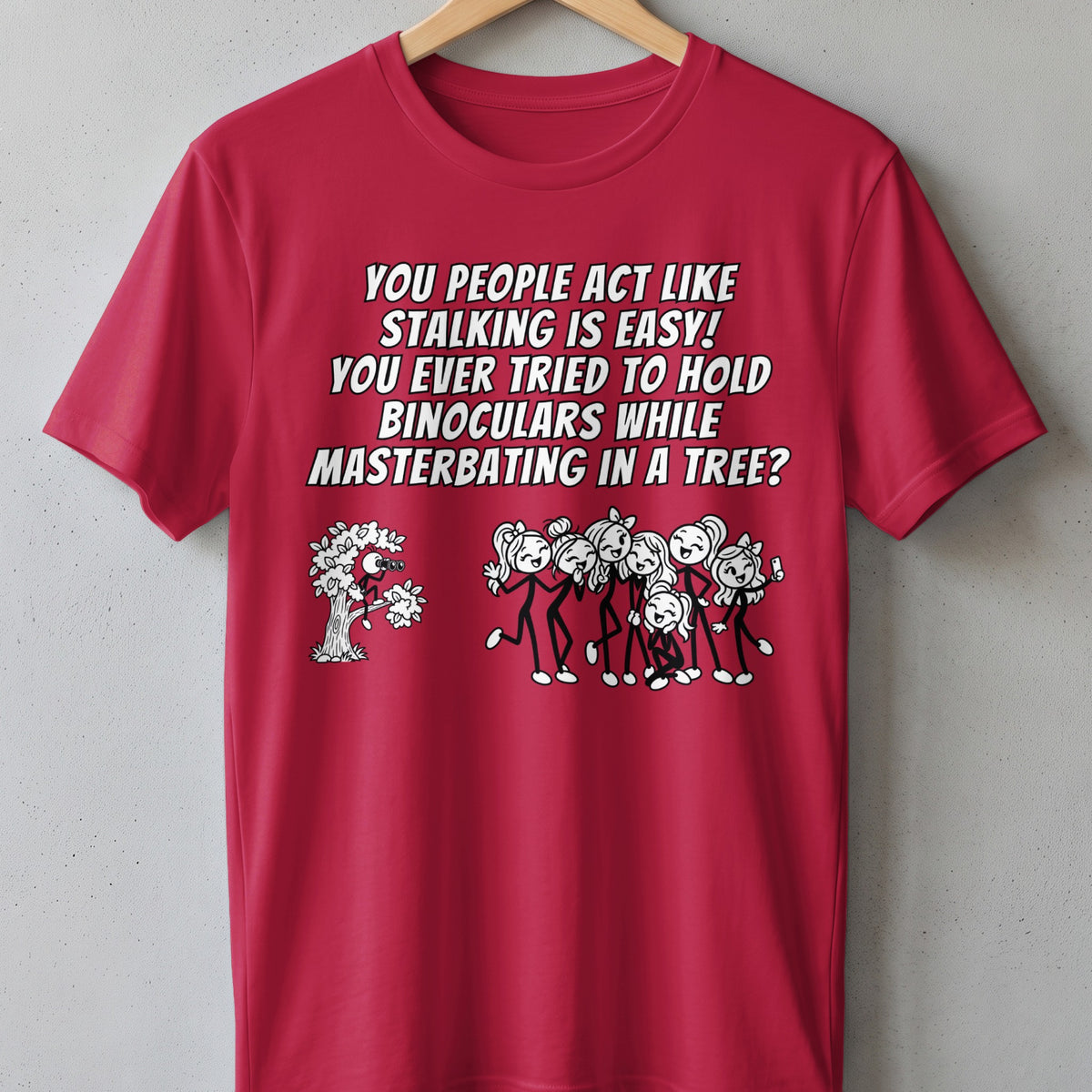 Red t-shirt with text and cartoon about stalking in a tree.