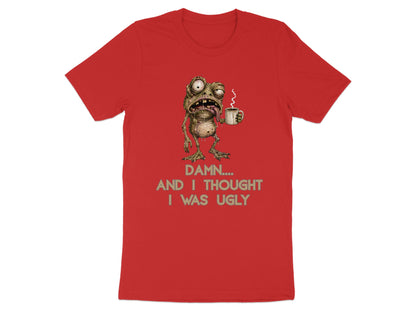 Red t-shirt with a grotesque frog holding a coffee cup and text reading "DAMN.... AND I THOUGHT I WAS UGLY".