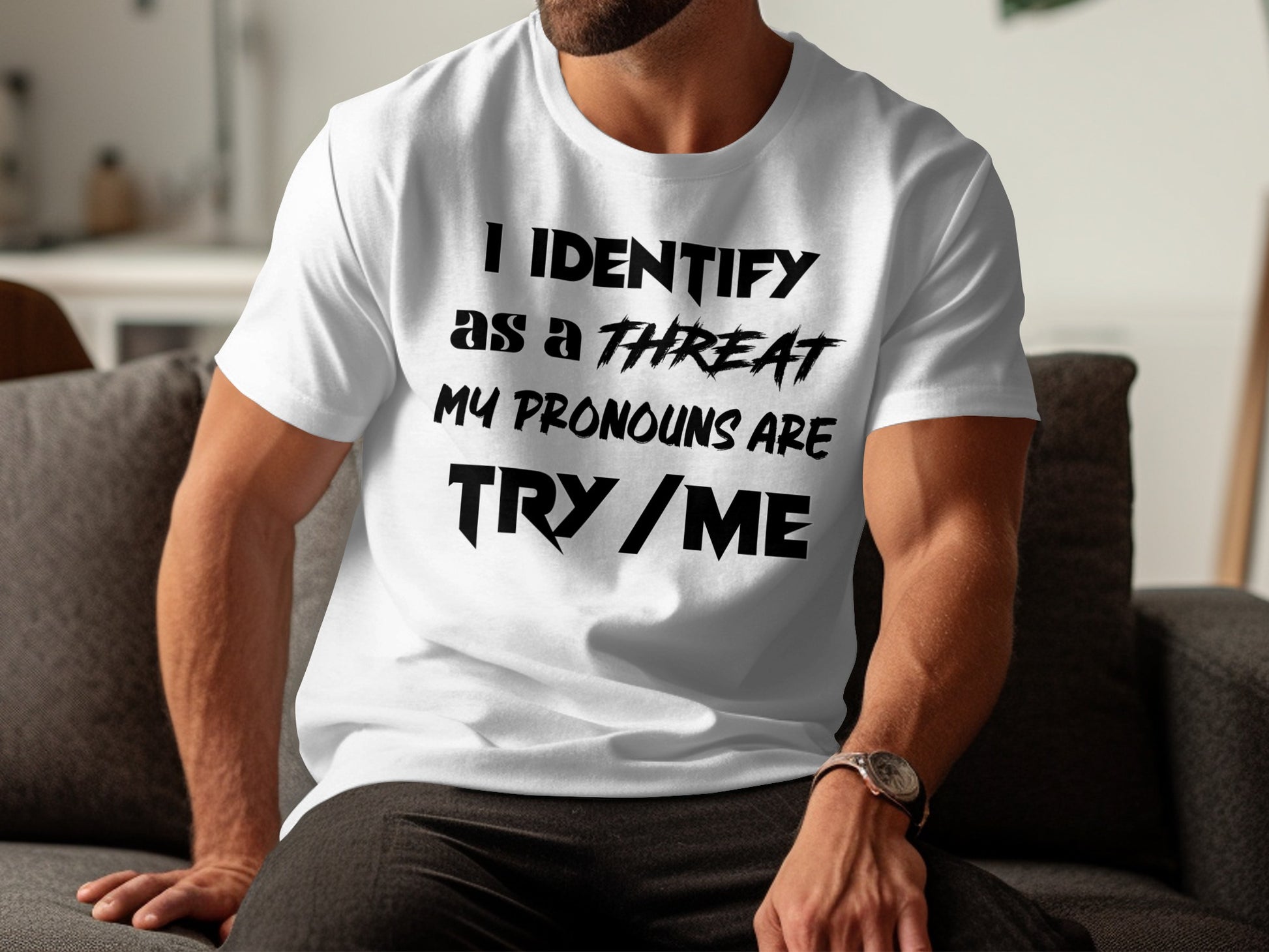 White t-shirt with black text "I IDENTIFY AS A THREAT MY PRONOUNS ARE TRY / ME".