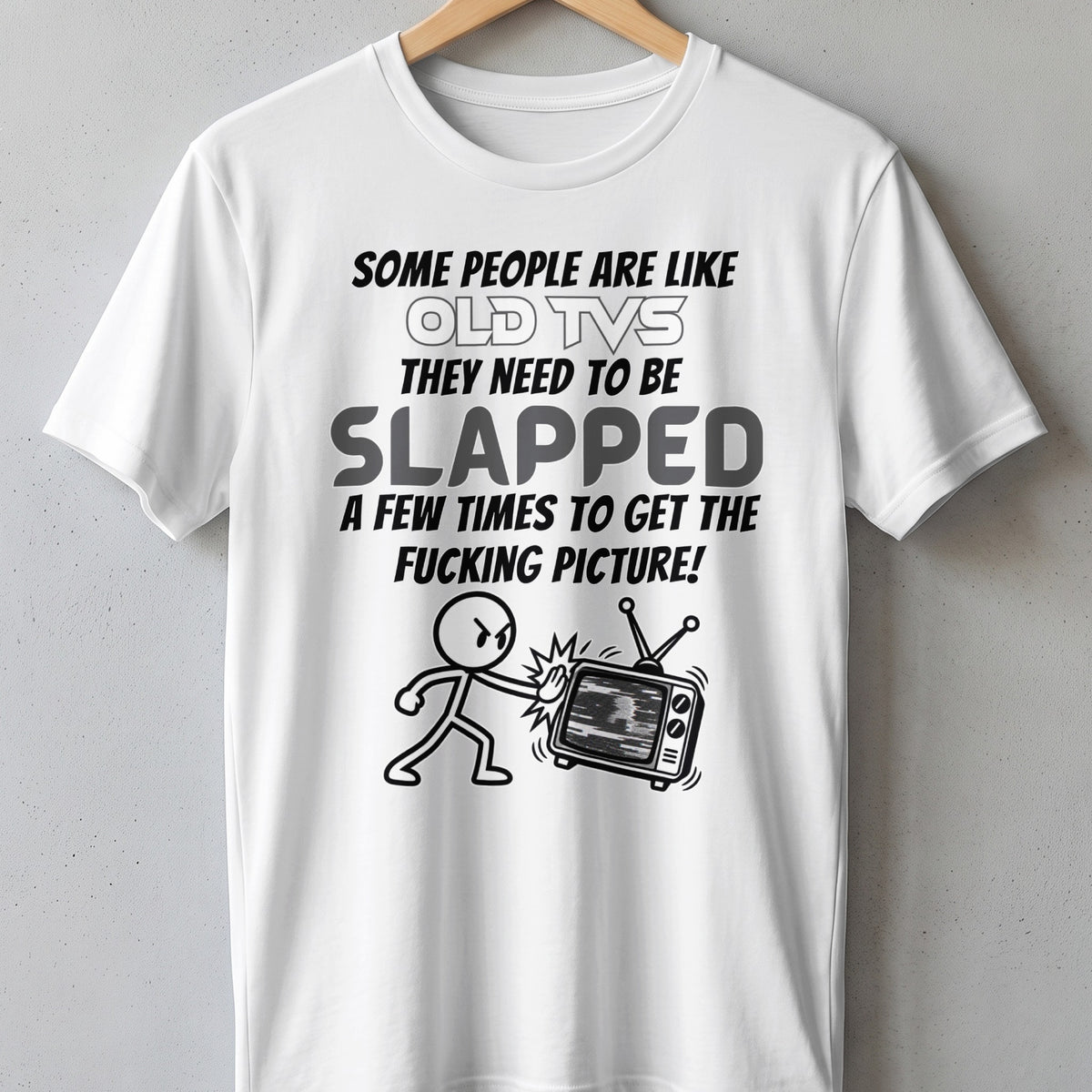 White t-shirt with text and cartoon: "Some people are like old TVs, they need to be slapped."