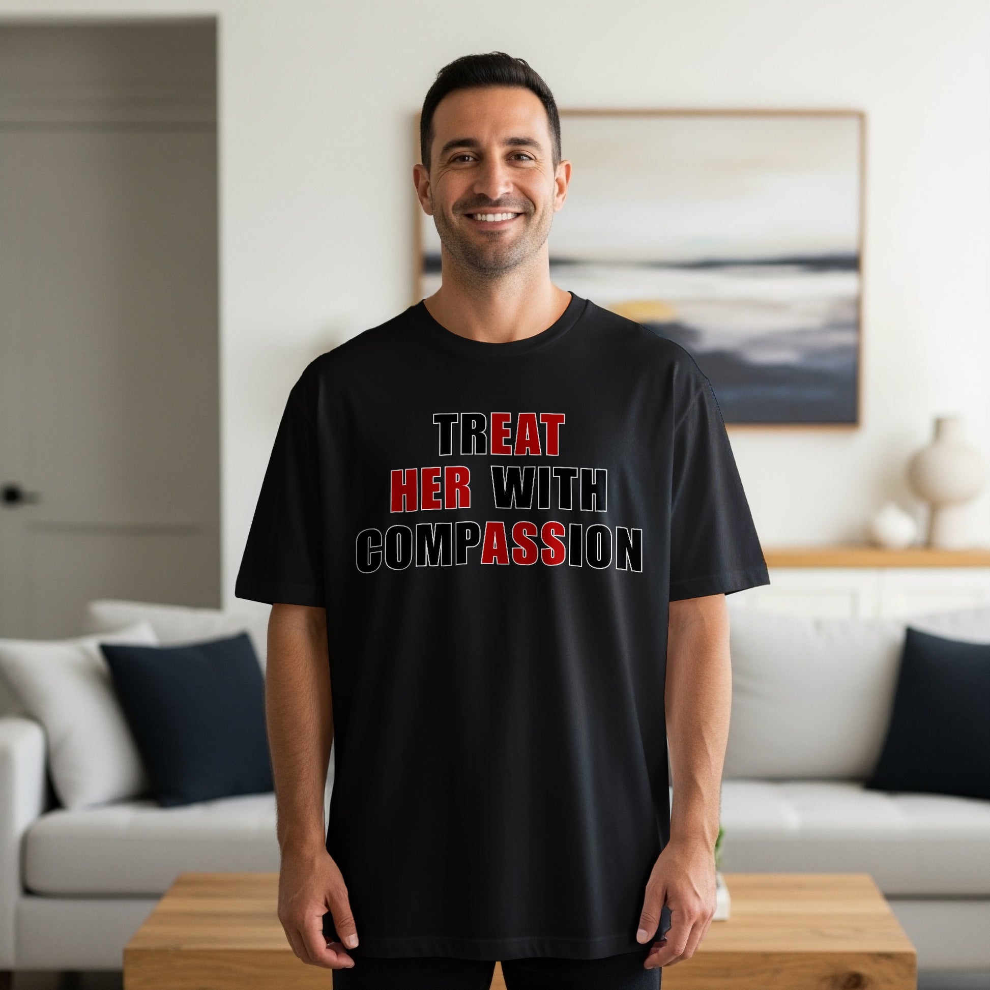 Black t-shirt with white and red text "TREAT HER WITH COMPASSION"
