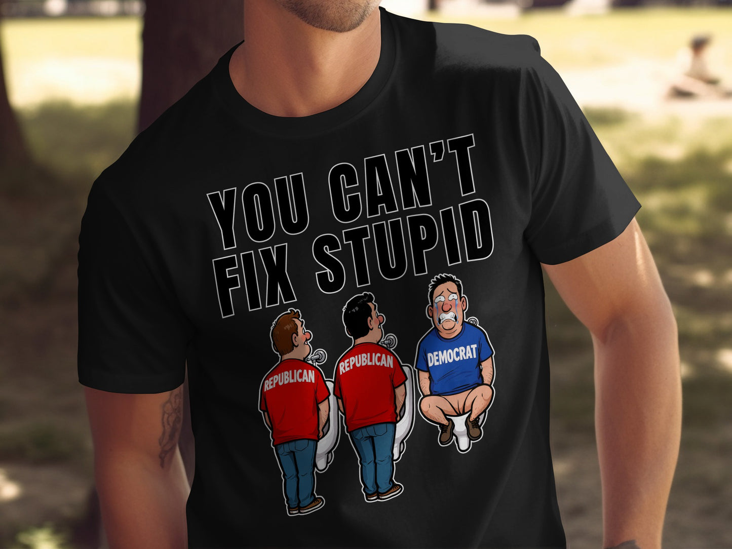Black t-shirt with "YOU CAN'T FIX STUPID" and cartoon of two Republicans and one Democrat.