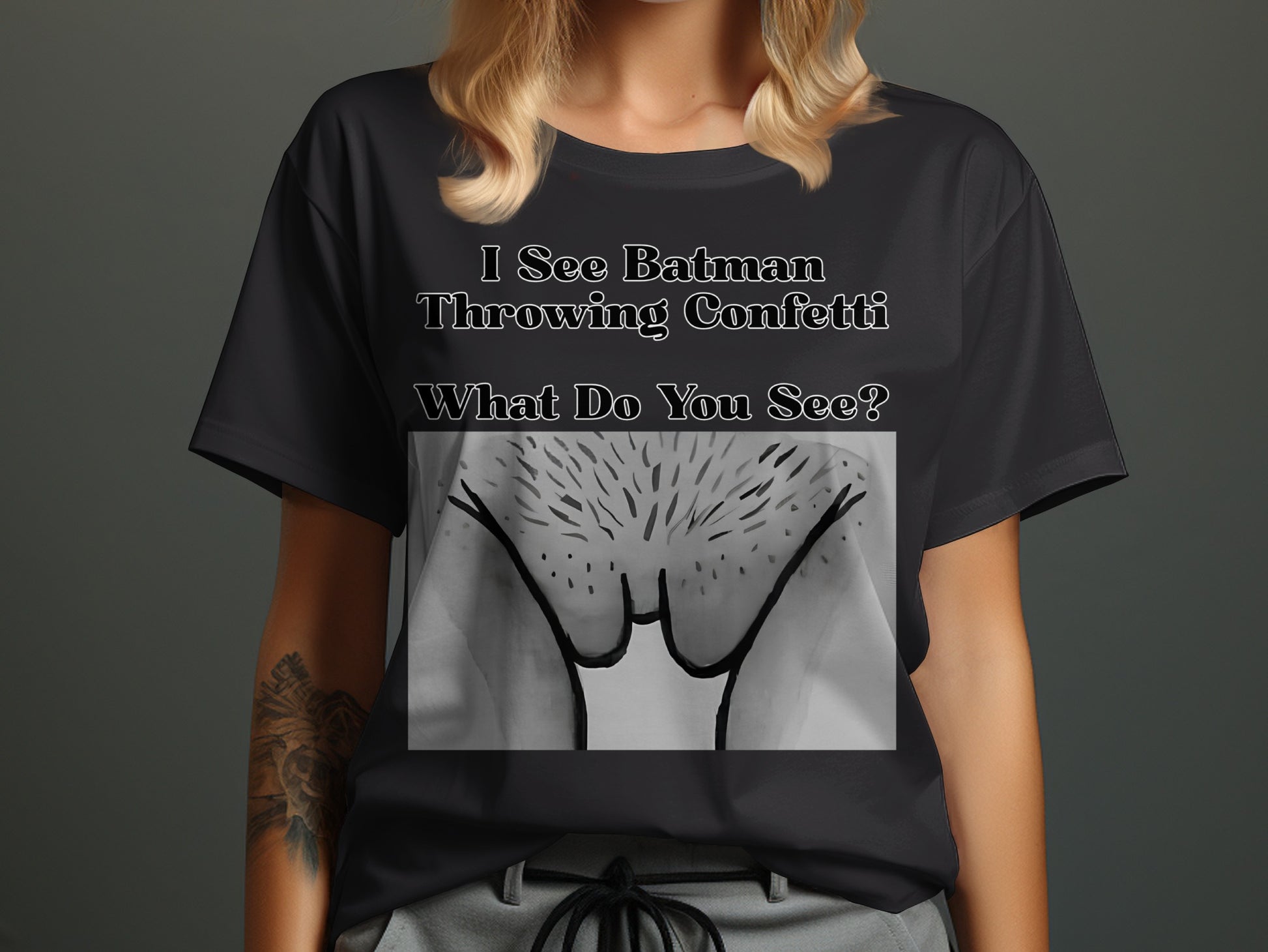 Black t-shirt with text and line drawing of pubic hair.