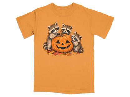Three raccoons surround a jack-o'-lantern on a pile of autumn leaves.