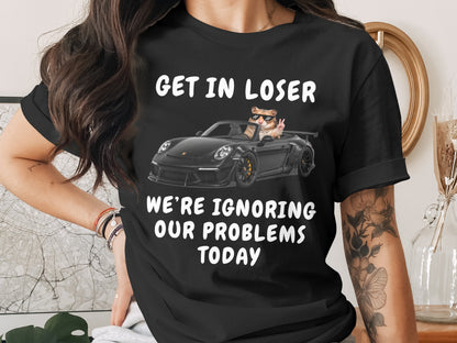 Black t-shirt with "GET IN LOSER WE'RE IGNORING OUR PROBLEMS TODAY" and hamster in car.
