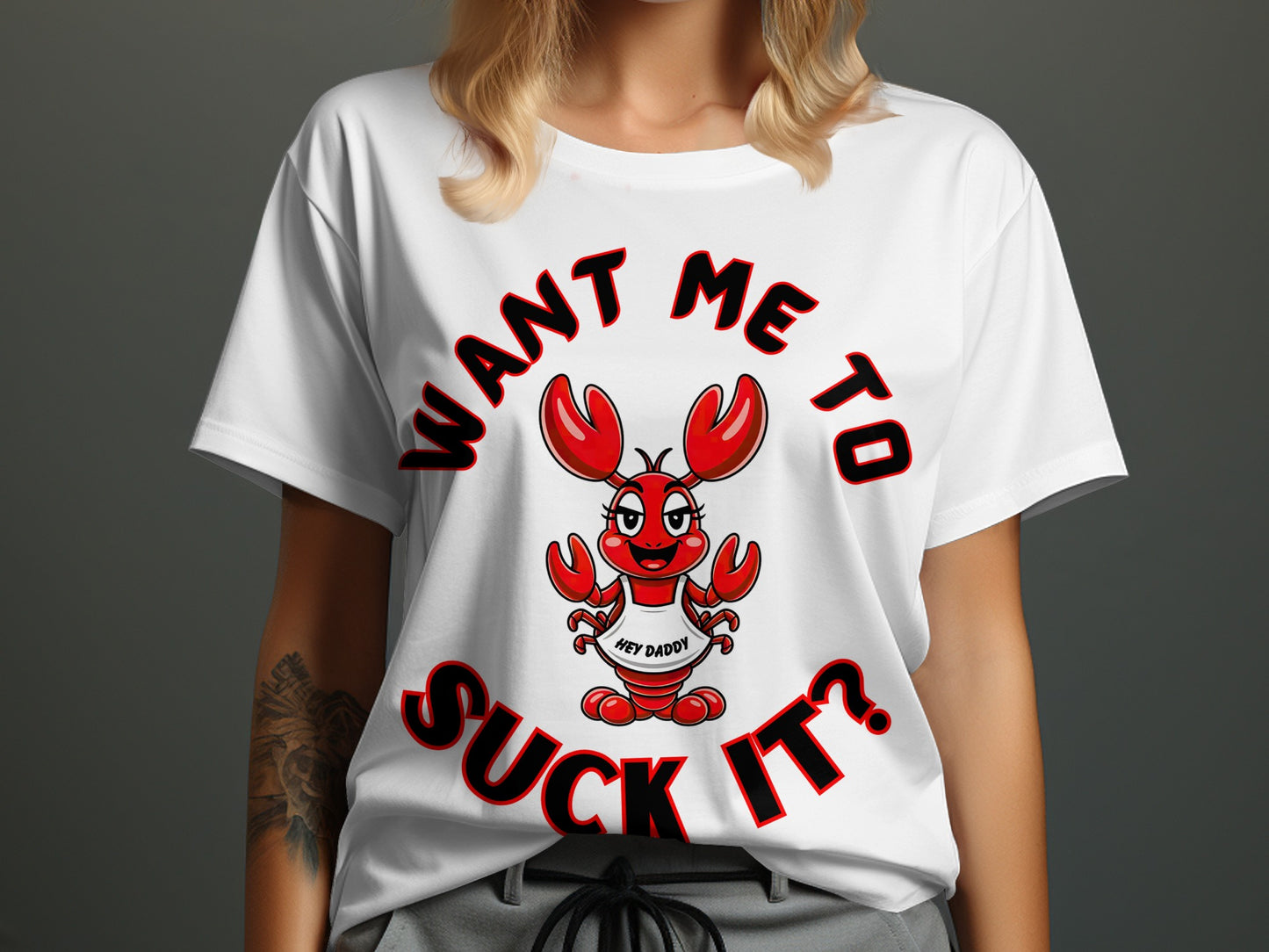 White t-shirt with cartoon lobster saying "WANT ME TO SUCK IT?"