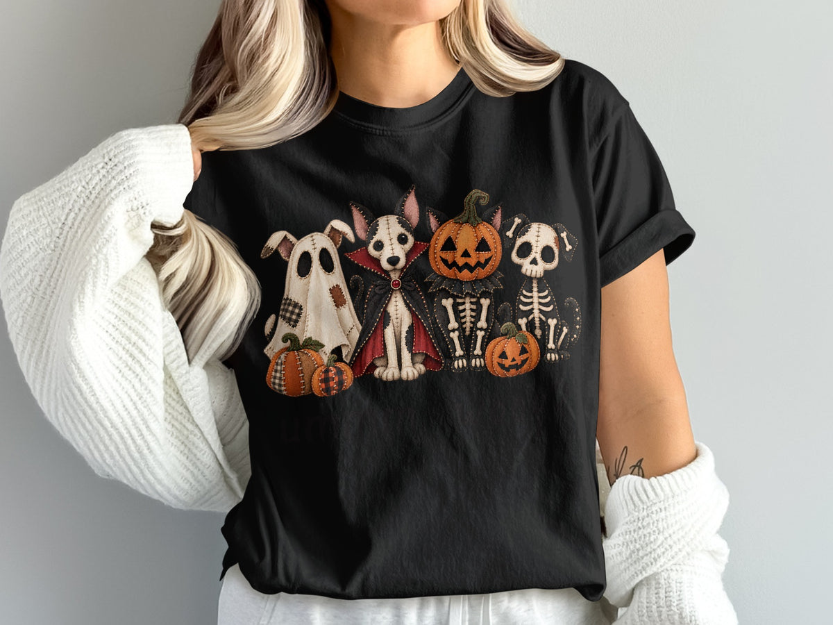 Black t-shirt with Halloween-themed graphic of spooky dog characters and pumpkins.