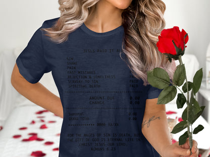 Navy t-shirt with receipt-style text listing sins and "Jesus Paid It All."