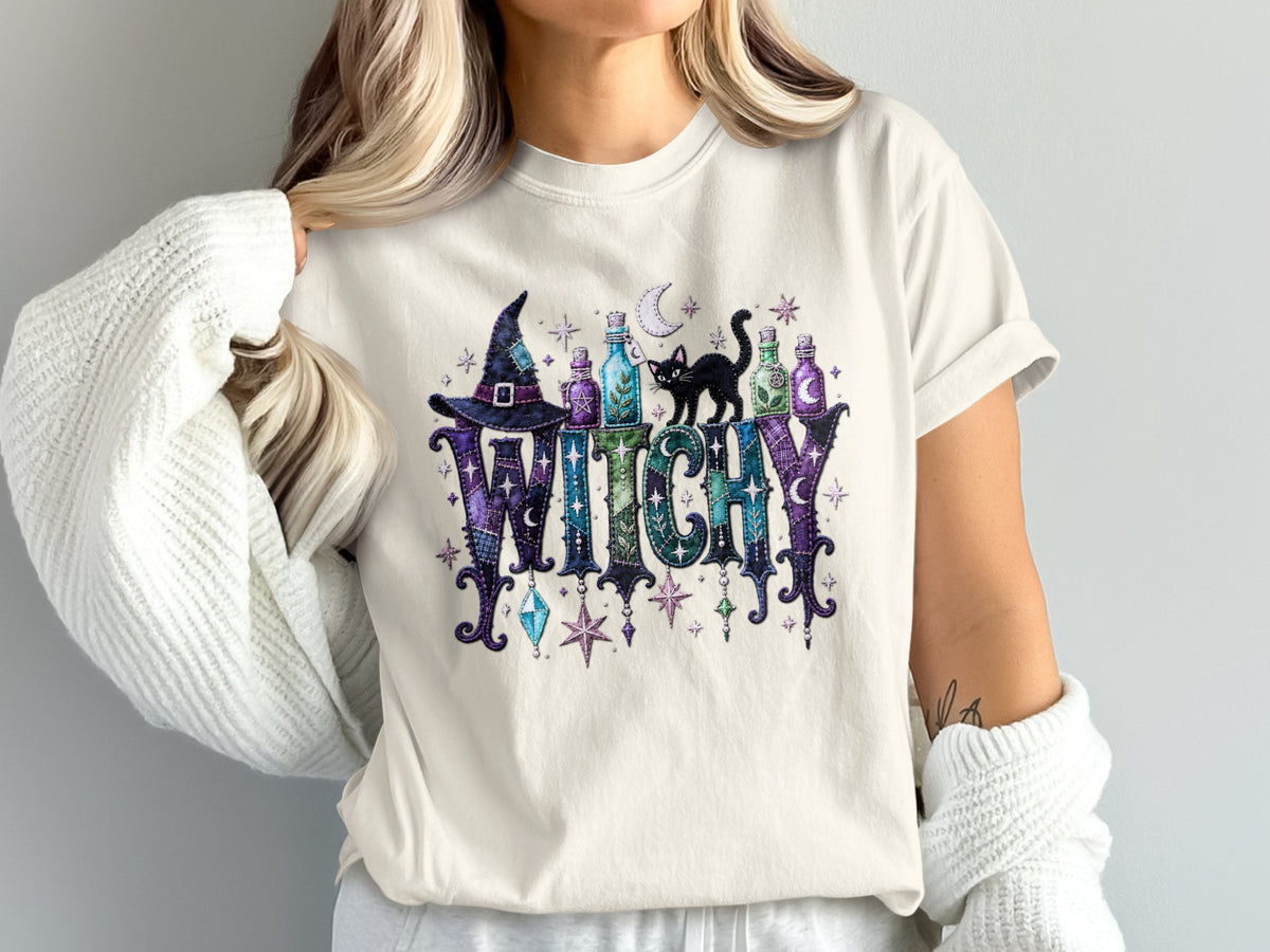 T-shirt with "WITCHY" text, black cat, witch hat, potions, moon, and stars.