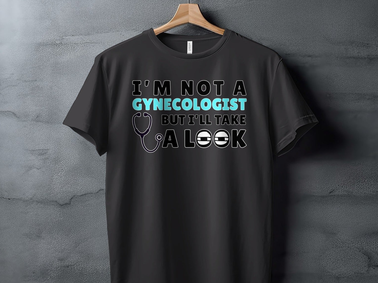 Black t-shirt with text "I'm not a gynecologist but I'll take a look".