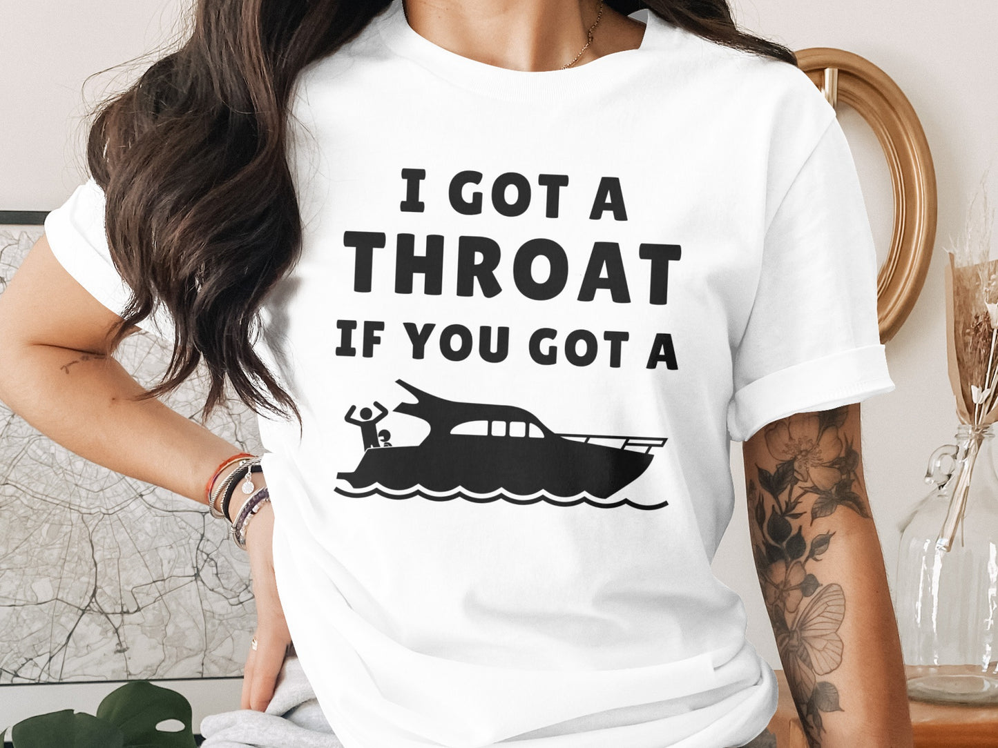 White t-shirt with black text "I GOT A THROAT IF YOU GOT A" and a boat graphic.