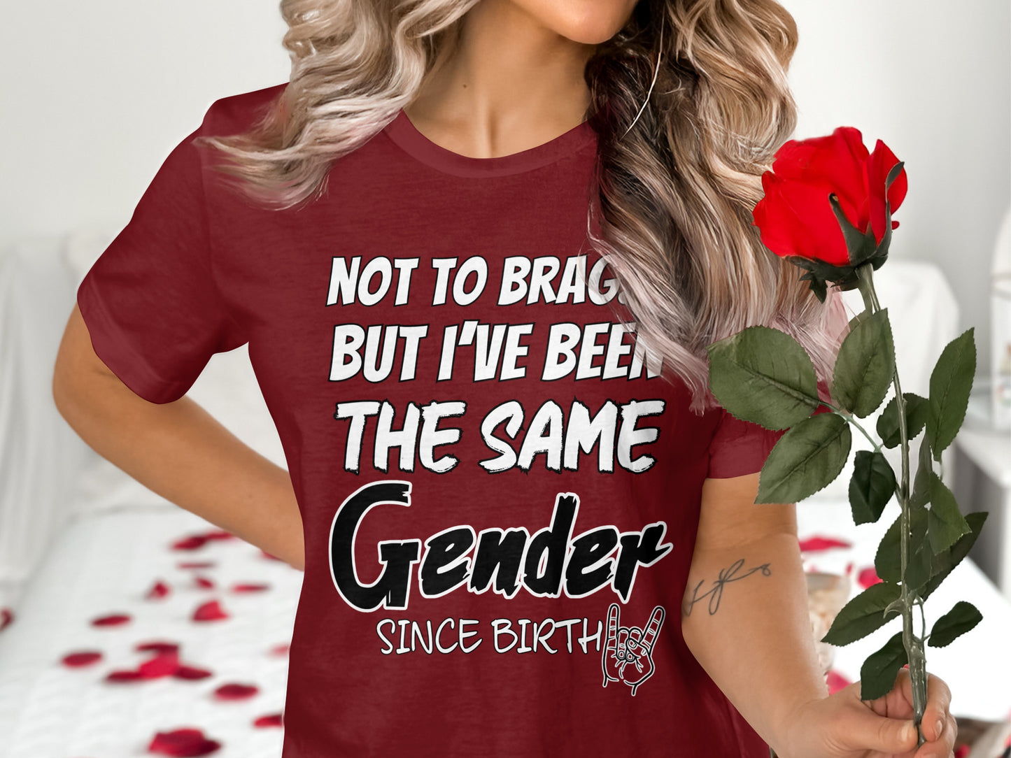 Maroon t-shirt with "Not to brag but I've been the same Gender since birth" text.