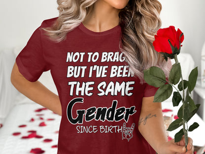 Maroon t-shirt with "Not to brag but I've been the same Gender since birth" text.