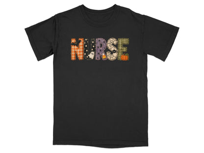 Black t-shirt with Halloween-themed "NURSE" lettering featuring patches, a ghost, and a pumpkin.