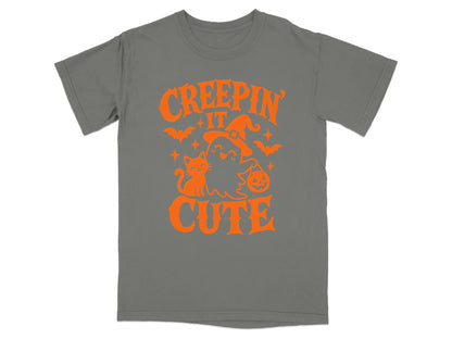 Grey t-shirt with orange Halloween graphic and text "Creepin' It Cute".