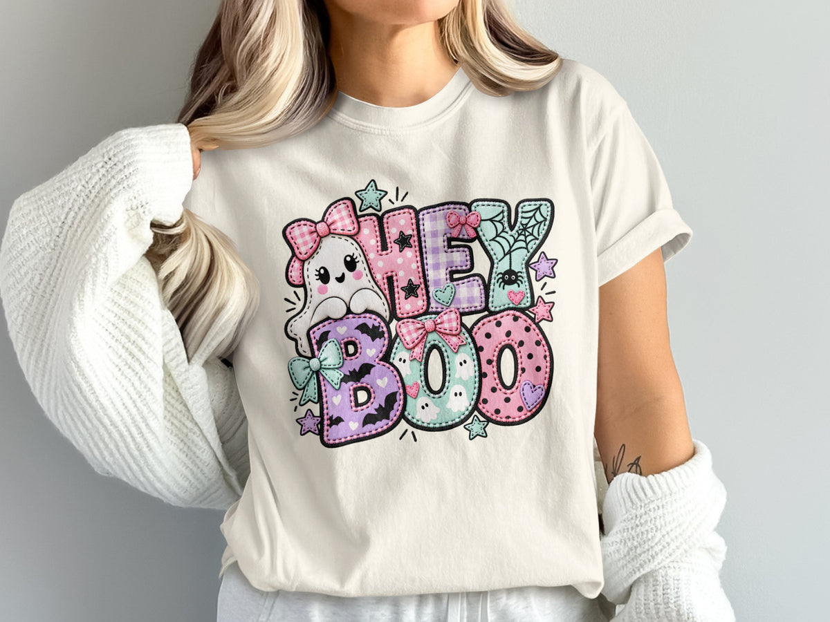 Ghost with bows and "HEY BOO" text with pastel patterns, spiders, bats, and stars.