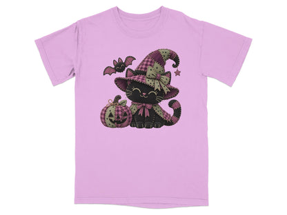 Black cat wearing a witch hat with pumpkin and bat, on a pink t-shirt.