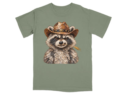 Raccoon wearing cowboy hat with wheat in mouth on green t-shirt.