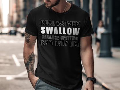 Black t-shirt with text: Real women swallow, because spitting isn't lady like.