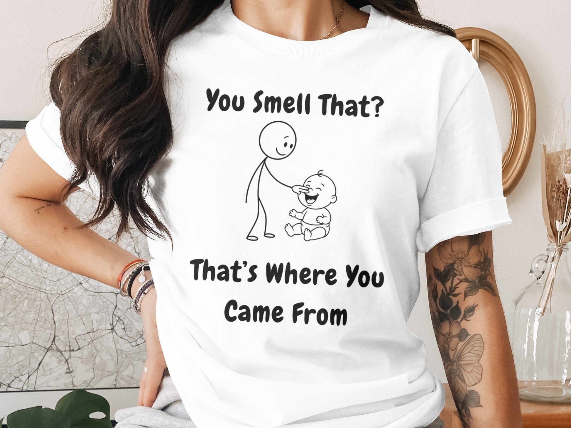 White t-shirt with drawing and text "You Smell That? That's Where You Came From".