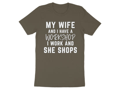 Brown t-shirt with white text "MY WIFE AND I HAVE A WORKSHOP I WORK AND SHE SHOPS".