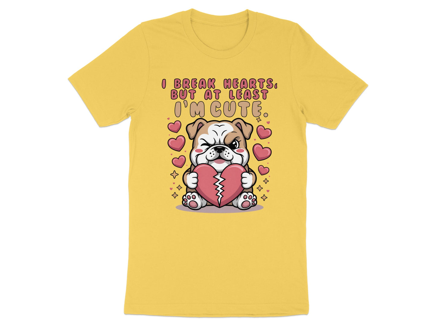 Yellow t-shirt with cartoon bulldog holding heart, text reads "I break hearts, but at least I'm cute."