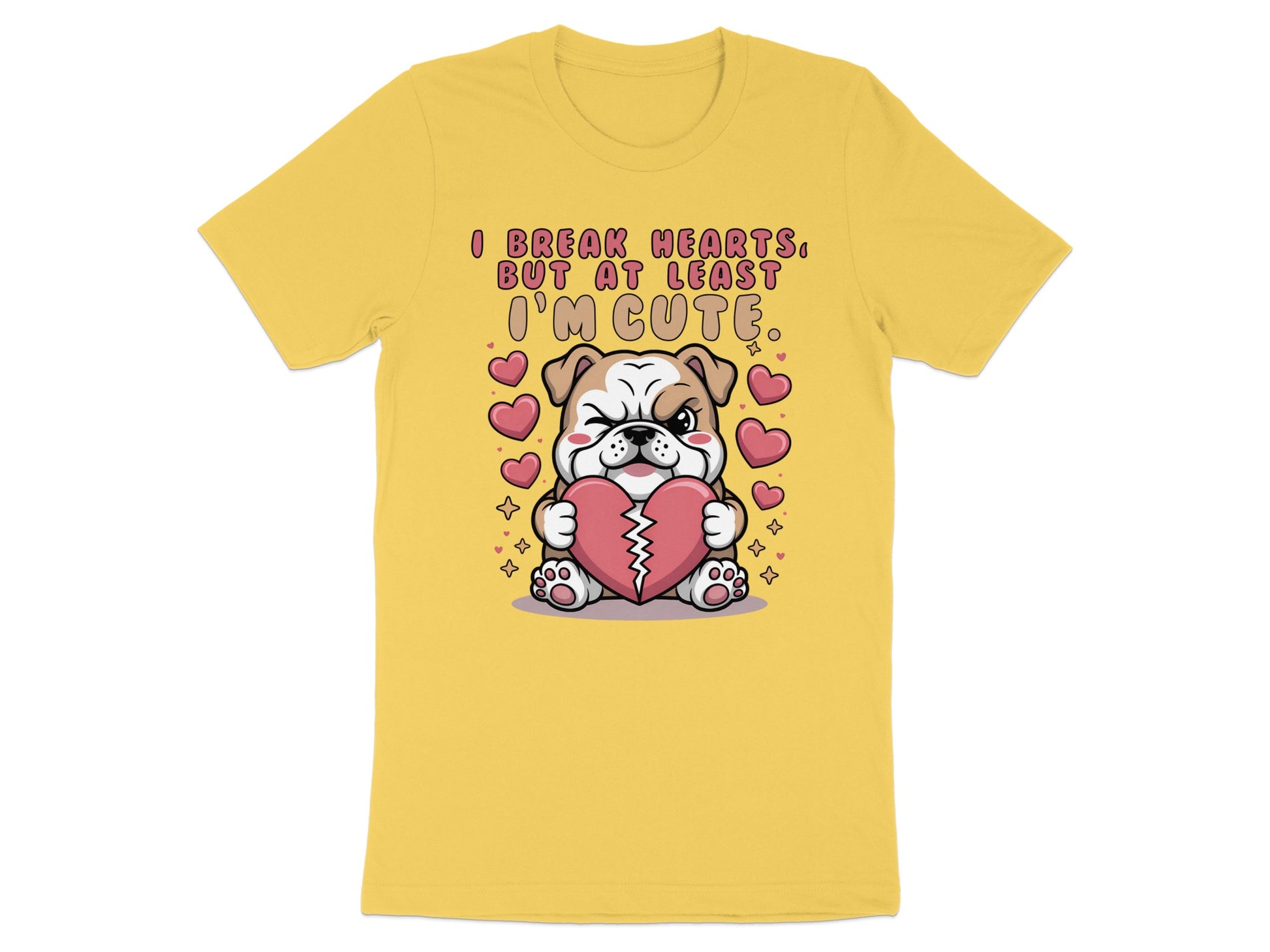 Yellow t-shirt with cartoon bulldog holding heart, text reads "I break hearts, but at least I'm cute."