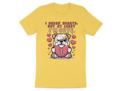 Yellow t-shirt with cartoon bulldog holding heart, text reads "I break hearts, but at least I'm cute."